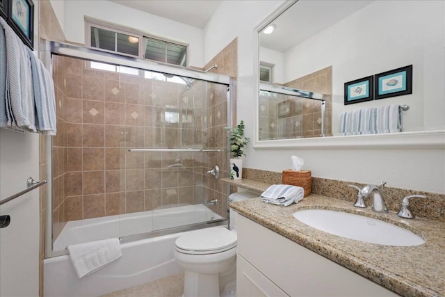 full bathroom featuring shower / bath combination with glass door, toilet, tile floors, and large vanity