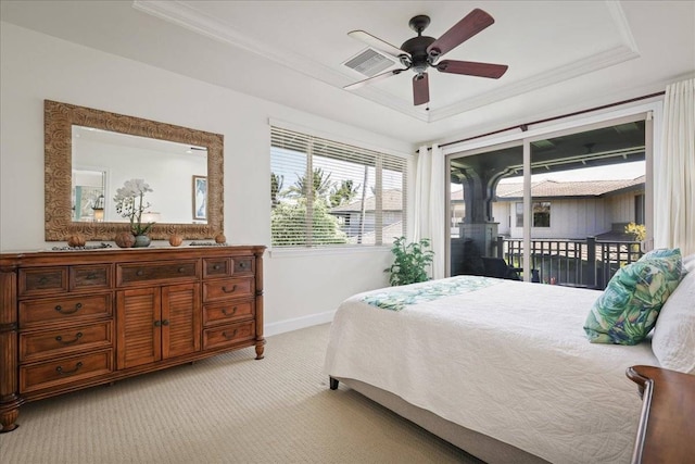 bedroom with access to exterior, ceiling fan, ornamental molding, light carpet, and a tray ceiling