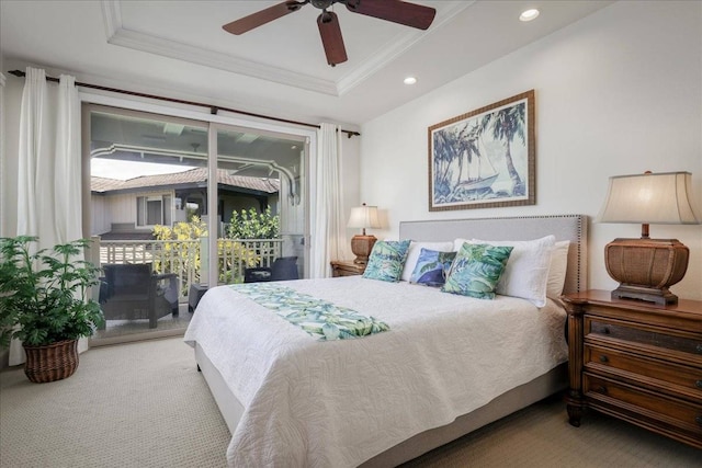 bedroom with access to exterior, ceiling fan, light colored carpet, a raised ceiling, and multiple windows