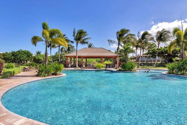 view of swimming pool with a patio and a gazebo