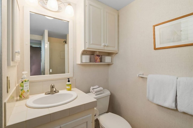 bathroom featuring toilet and oversized vanity