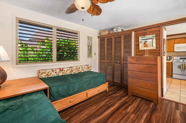 bedroom featuring tile floors and ceiling fan