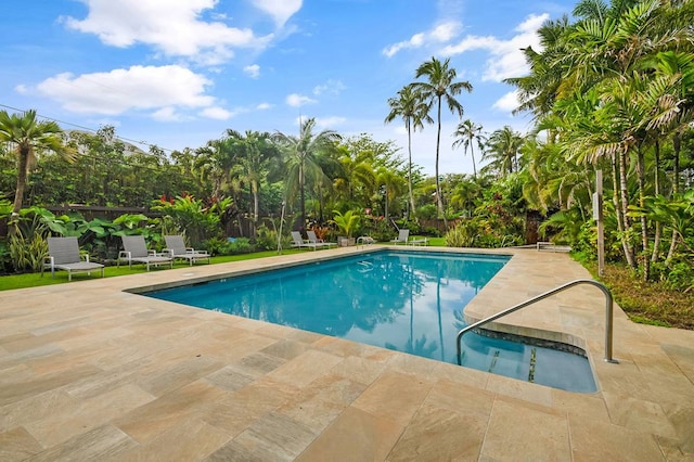 view of swimming pool with a patio