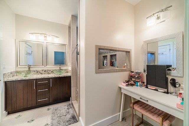 bathroom featuring large vanity and tile floors