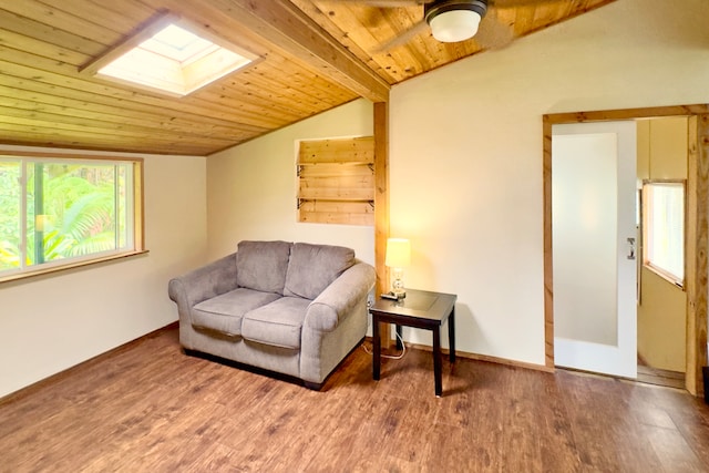 sitting room featuring hardwood / wood-style floors, lofted ceiling with skylight, and wood ceiling