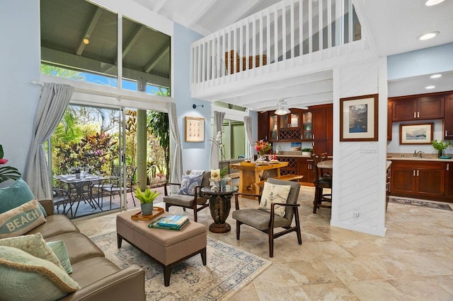 living room with ceiling fan, high vaulted ceiling, and light tile flooring