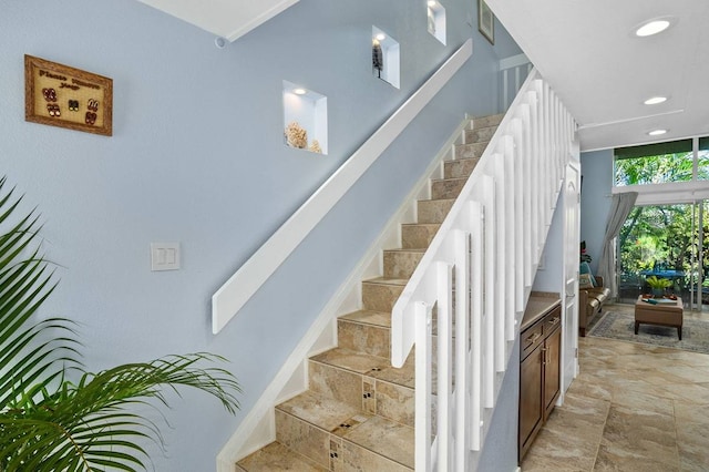 stairs featuring light tile floors