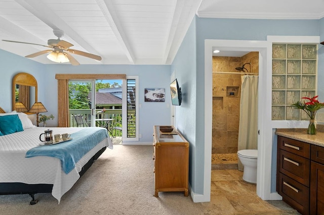 carpeted bedroom with ceiling fan, access to exterior, beamed ceiling, and ensuite bath