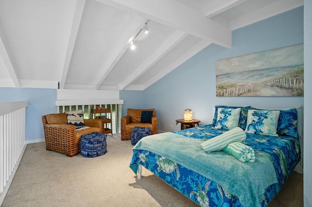 bedroom with lofted ceiling with beams, light carpet, and rail lighting