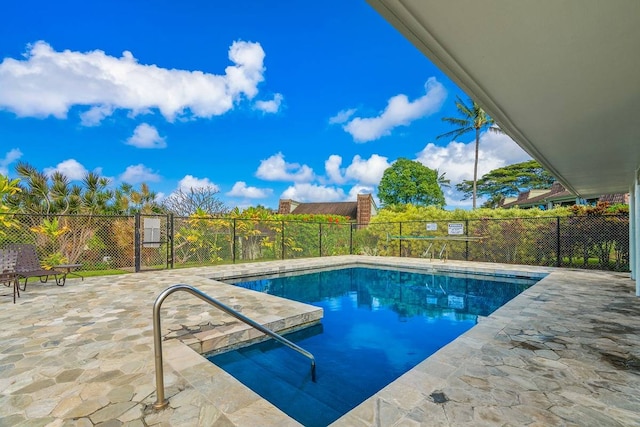 view of swimming pool featuring a patio area