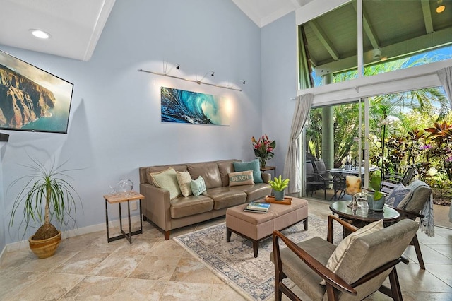 living room featuring beamed ceiling, high vaulted ceiling, and light tile floors