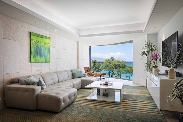 living room featuring a raised ceiling