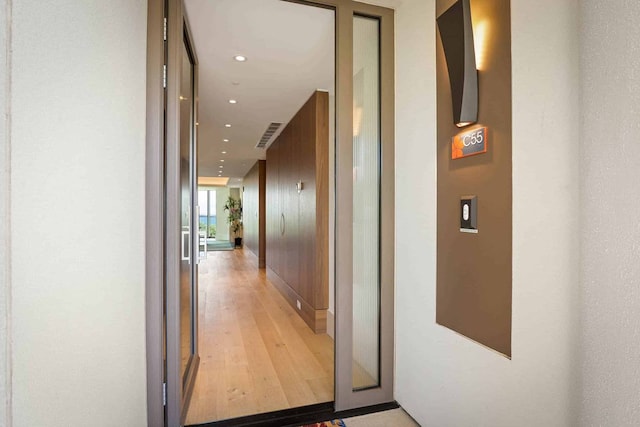 hallway with light wood-type flooring