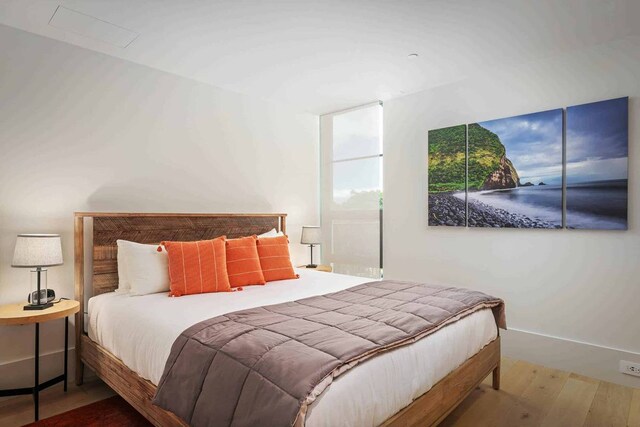 bedroom featuring hardwood / wood-style flooring