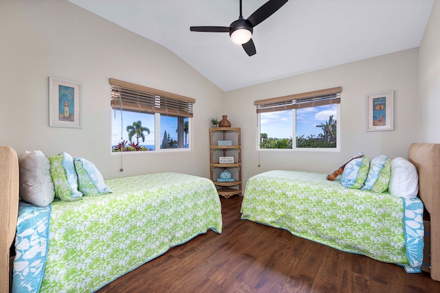 bedroom featuring ceiling fan, dark hardwood / wood-style floors, and vaulted ceiling