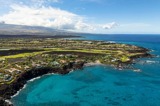 drone / aerial view with a water and mountain view