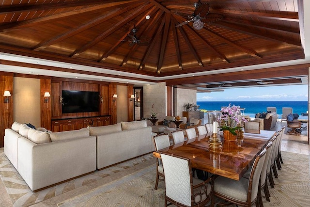 dining space with a water view, wooden ceiling, ceiling fan, and beamed ceiling