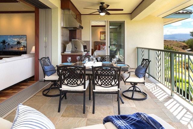 balcony with a grill, area for grilling, and ceiling fan