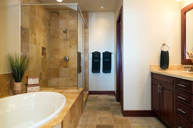 bathroom with tile flooring, plus walk in shower, and vanity