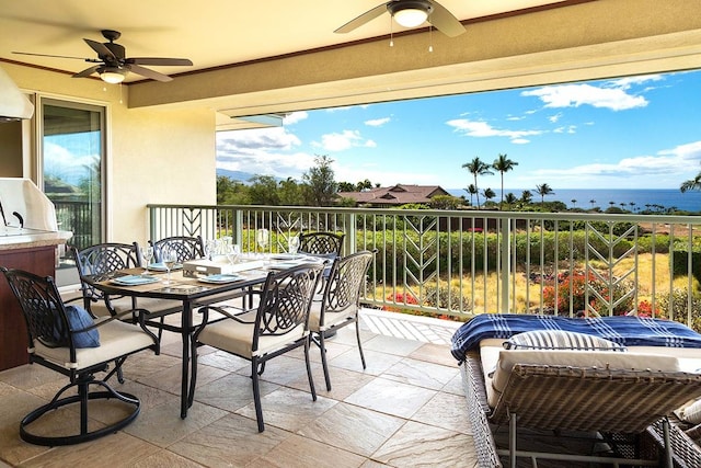 view of patio featuring ceiling fan and a water view