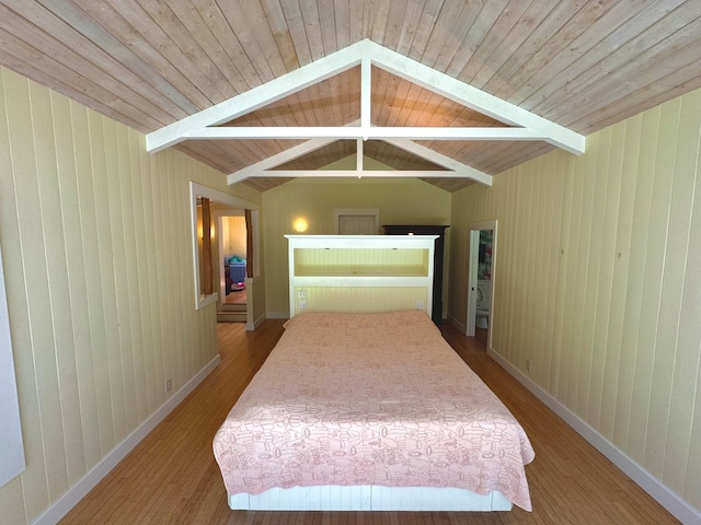 bedroom featuring wooden ceiling, wood-type flooring, and vaulted ceiling with beams