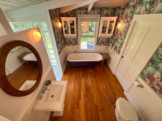 bathroom featuring wooden ceiling, lofted ceiling with beams, toilet, and hardwood / wood-style floors