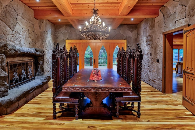 dining area with wooden ceiling, wood finished floors, and beam ceiling