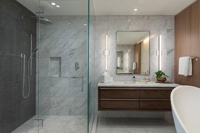 bathroom with tile walls, tile floors, plus walk in shower, and oversized vanity