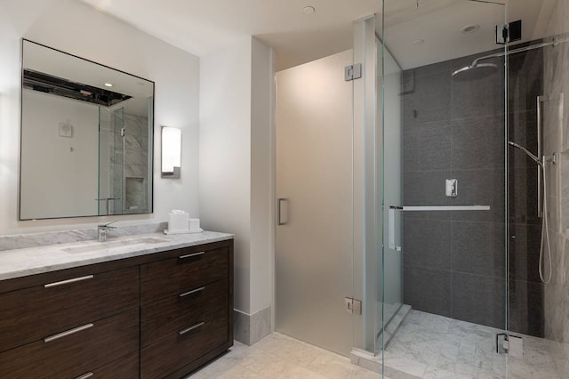 bathroom with vanity, walk in shower, and tile floors