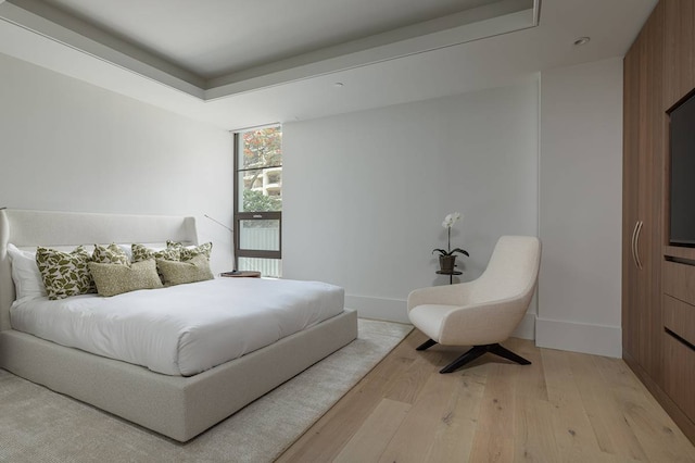 bedroom with light wood-type flooring