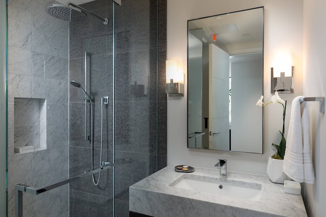 bathroom with walk in shower and oversized vanity