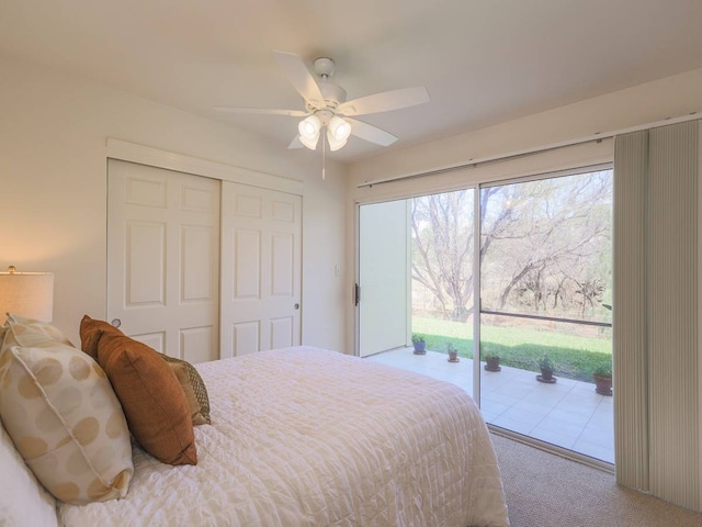 carpeted bedroom with access to outside, ceiling fan, and a closet