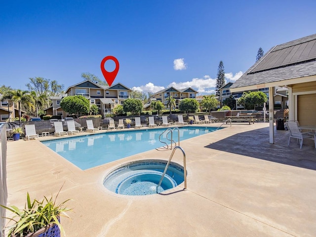 view of pool with a patio area and a community hot tub