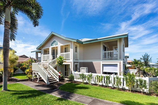 raised beach house with a front yard