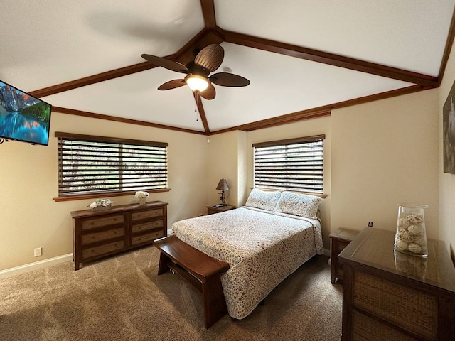 carpeted bedroom with ceiling fan, vaulted ceiling with beams, and multiple windows