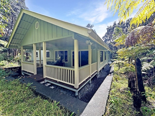 view of property exterior with covered porch