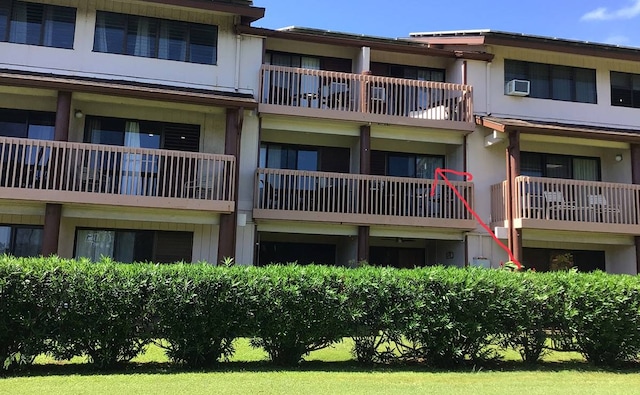 view of property featuring a wall unit AC