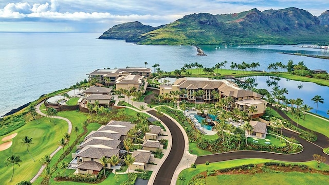 birds eye view of property with a water and mountain view