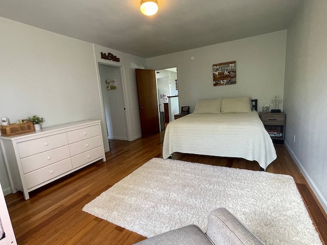 bedroom featuring dark hardwood / wood-style floors