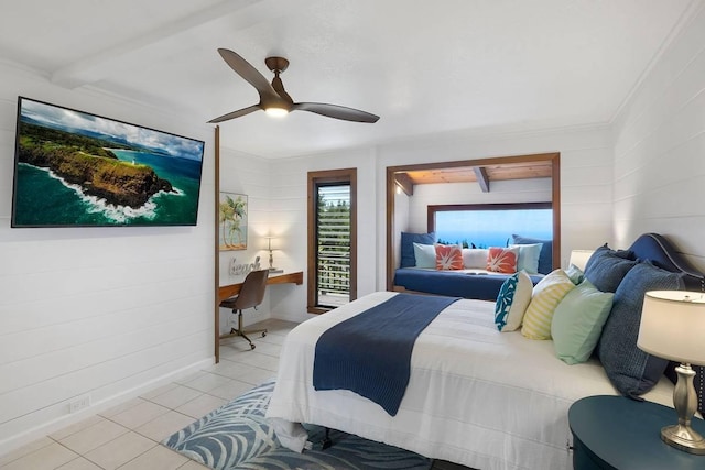 bedroom with light tile patterned floors, a ceiling fan, and baseboards