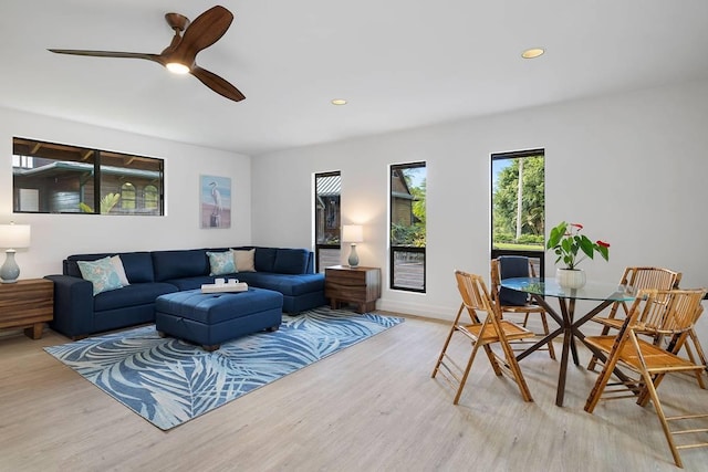 living room featuring a ceiling fan, recessed lighting, and light wood-style flooring