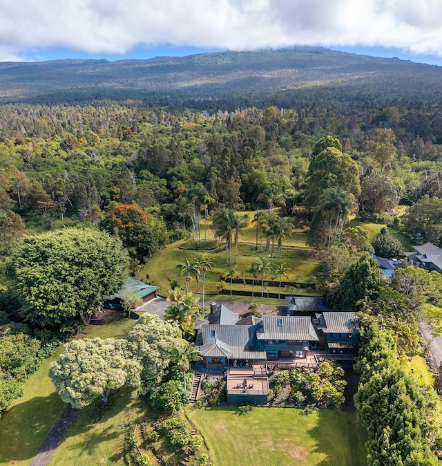 aerial view featuring a wooded view