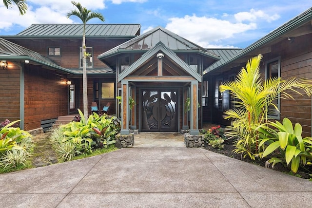 doorway to property featuring a standing seam roof and metal roof