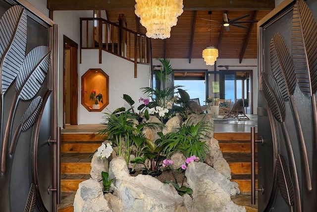 interior space with high vaulted ceiling, beam ceiling, wooden ceiling, and ceiling fan with notable chandelier