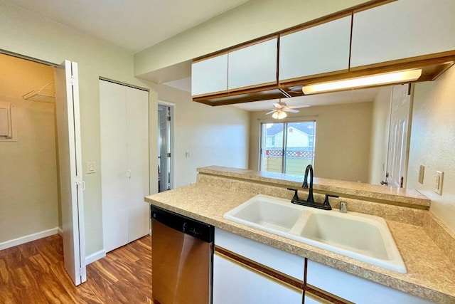 kitchen featuring ceiling fan, dishwasher, white cabinets, sink, and dark hardwood / wood-style flooring