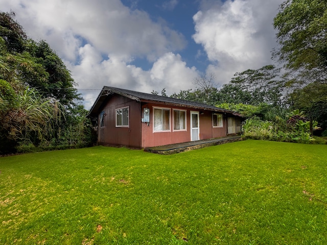 4373 Upa Rd, Koloa, HI 96756 - view of property exterior with a lawn