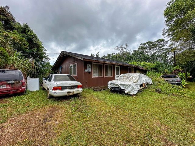 4373 Upa Rd, Koloa, HI 96756 - view of front facade with a front lawn