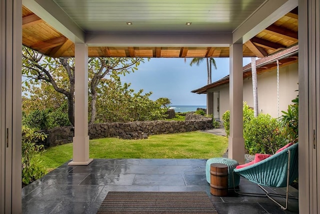 view of patio featuring a water view