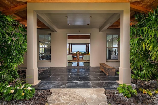 entrance to property featuring a patio