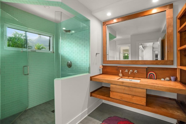 bathroom with tile patterned flooring, vanity, and an enclosed shower